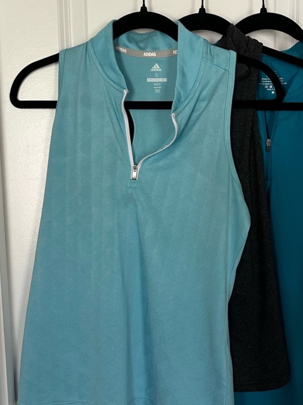 2 women’s zip golf tanks